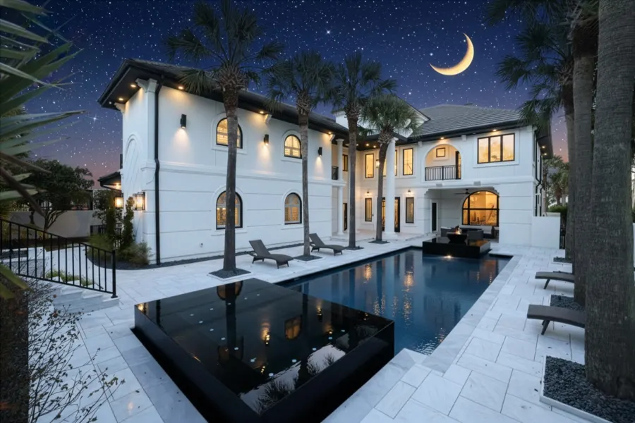 Modern home and pool at twilight